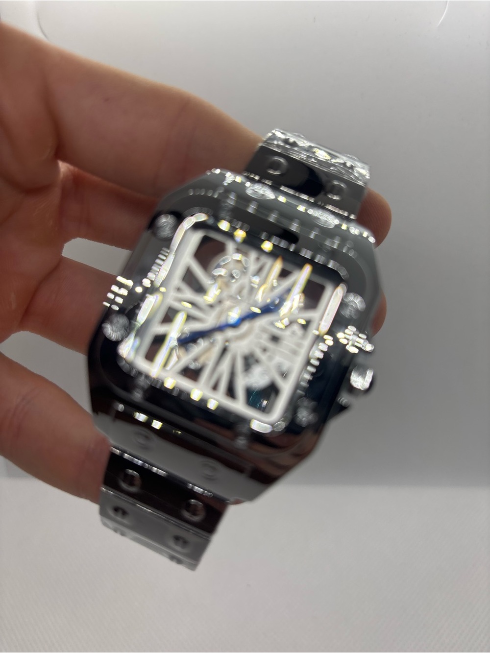 Men's Silver Stainless Steel Skeleton Watch with Blue Hands